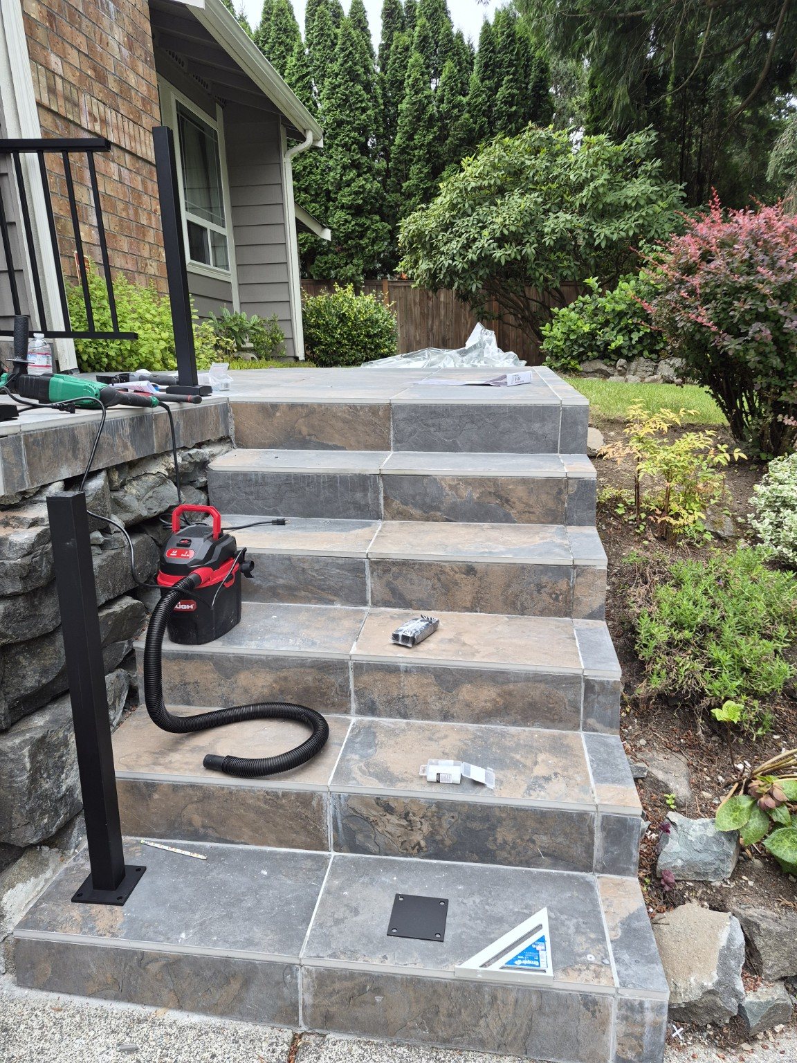 Exterior stair railing installation before