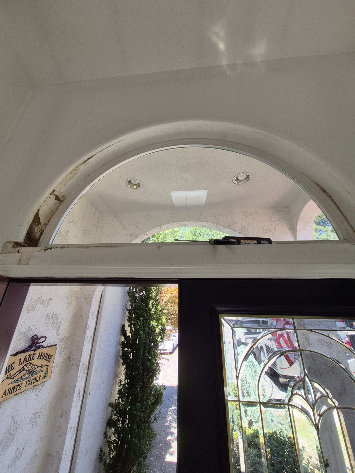Arched transom trim before repair